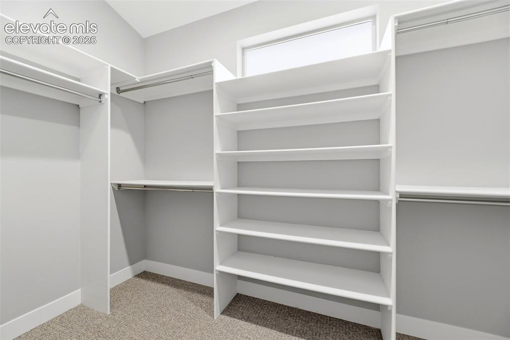 Image 29 of 42: Walk in Closet