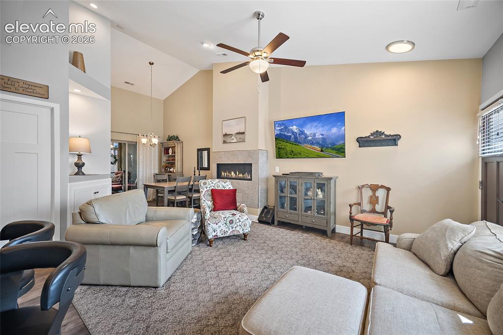 Image 5 of 25: Living & Dining Room with Gas Fireplace