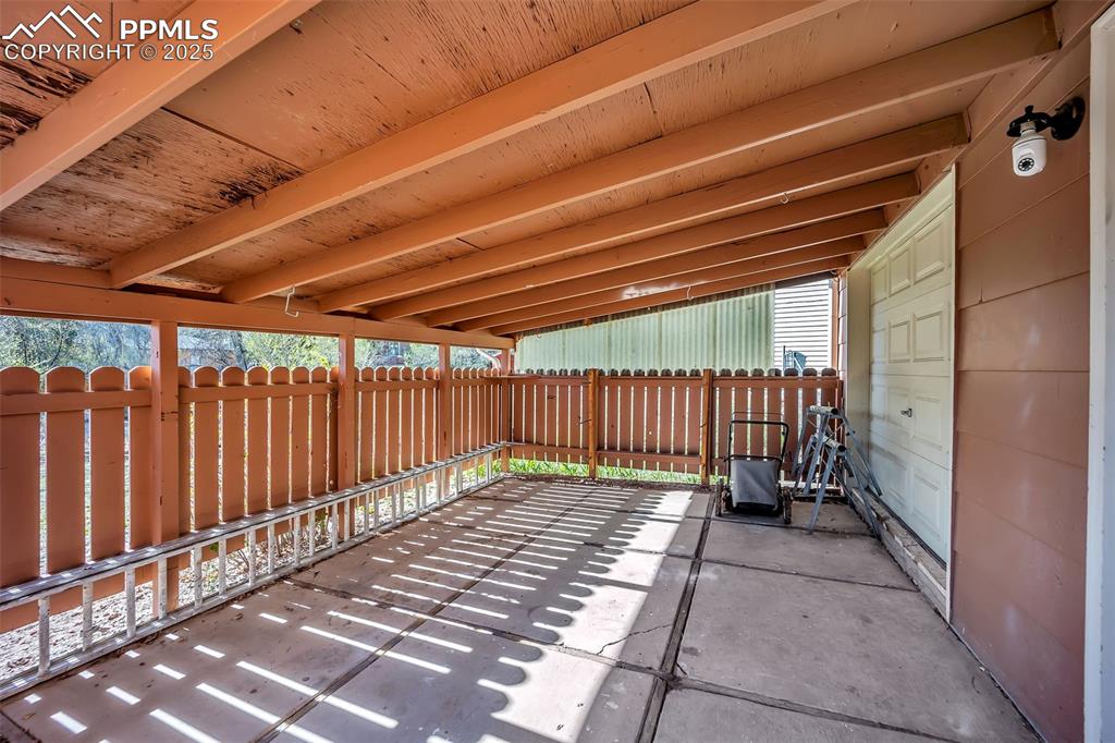 Image 39 of 50: Covered Utility Bay with Garage Access 