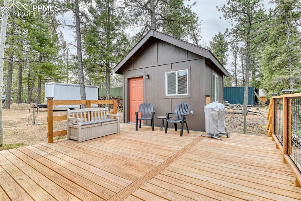 Image 31 of 48: Wooden deck featuring grilling area