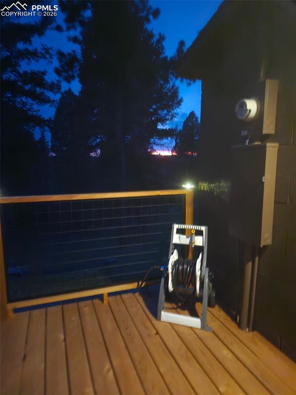 Image 45 of 48: View of deck at twilight