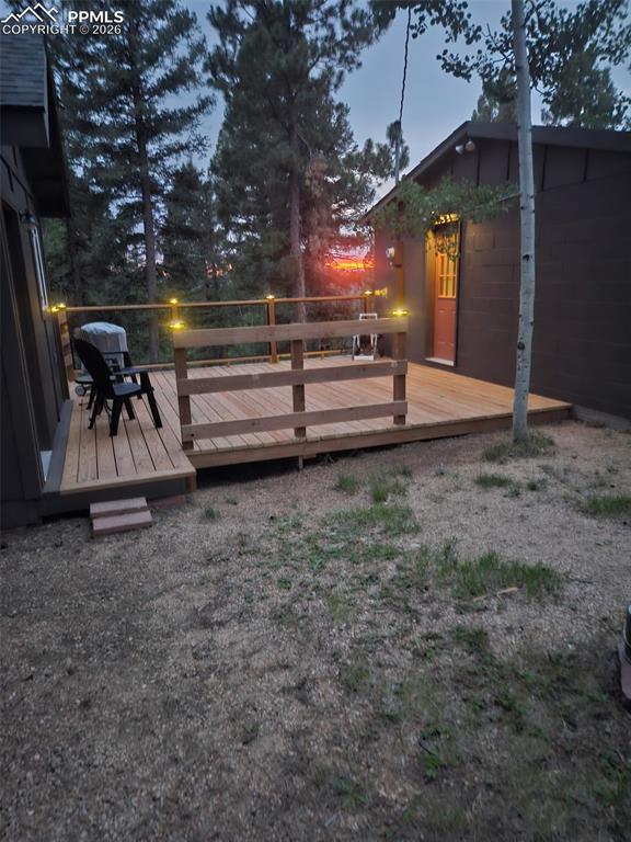Image 47 of 48: Wooden deck featuring grilling area