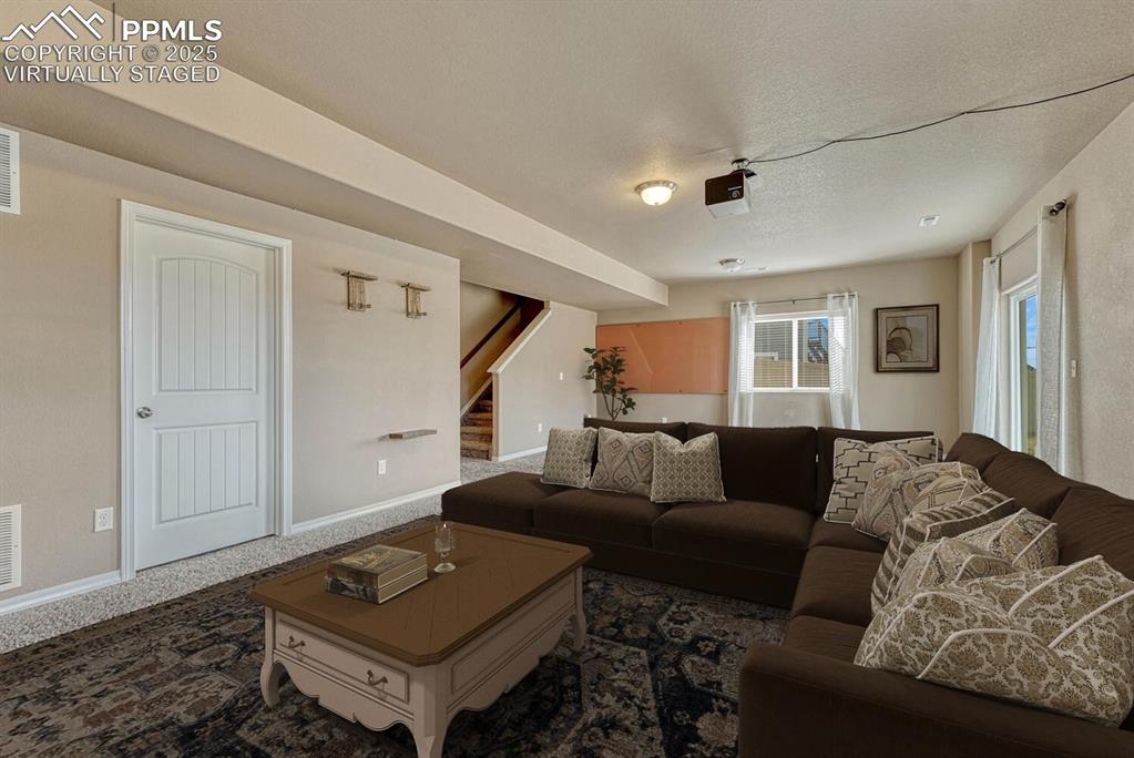 Image 25 of 50: Walk-out basement include pre-plumbing for wet bar, mounted projector, and 