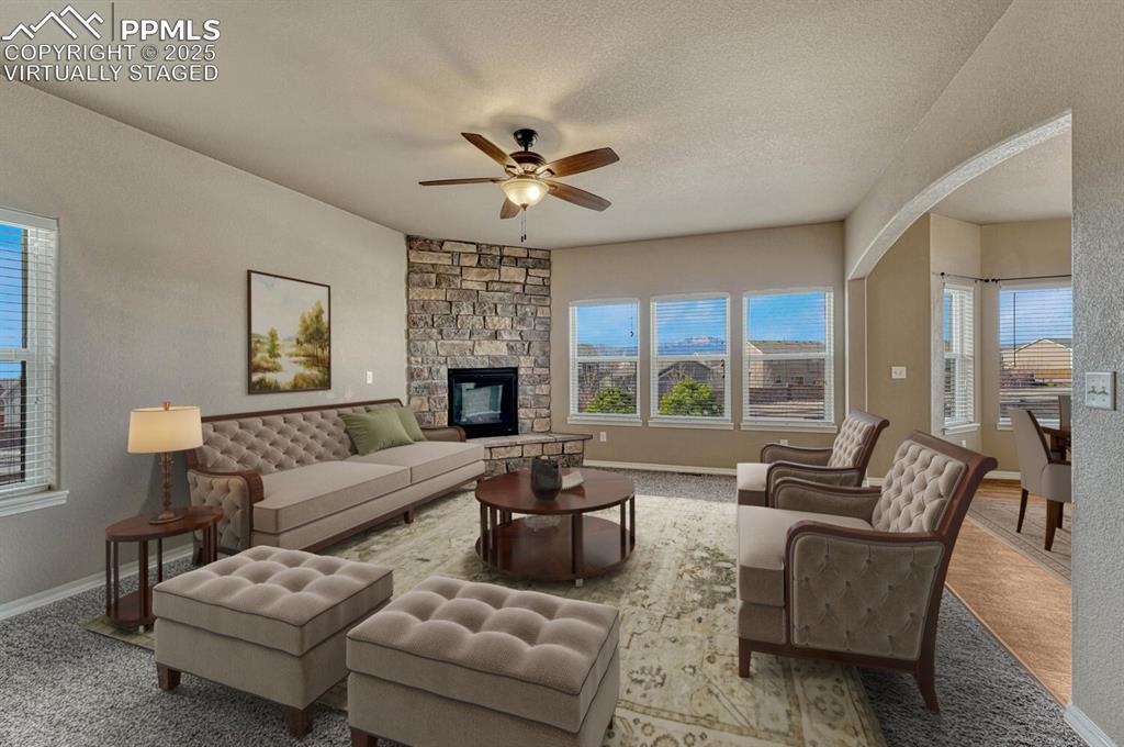 Image 5 of 50: Pikes Peak view! Living room virtually staged