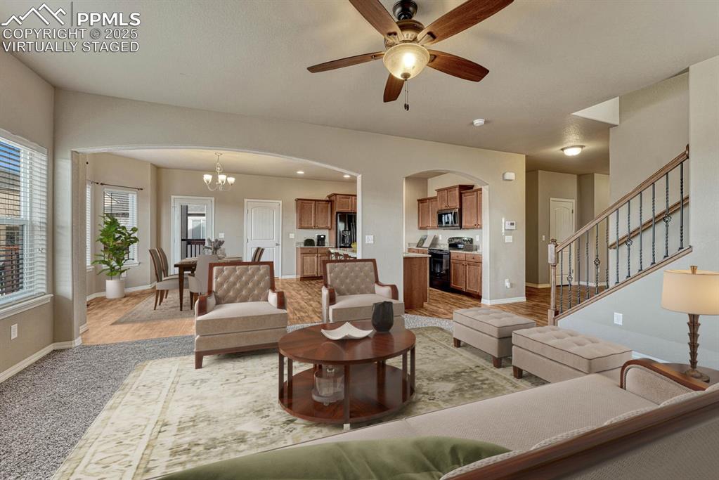 Image 8 of 50: Great room virtually staged