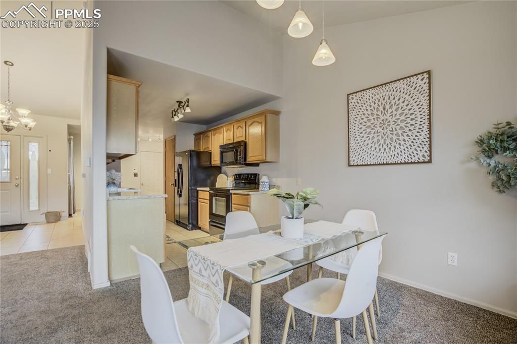 Image 12 of 42: Dining space just off kitchen