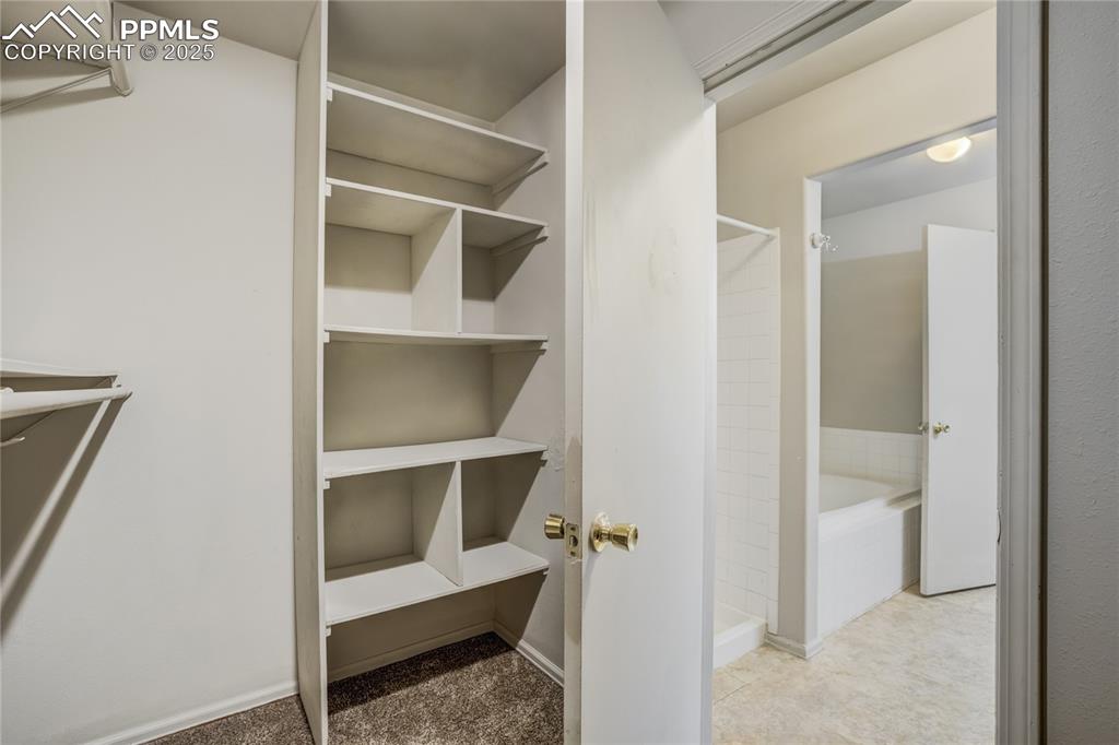 Image 20 of 42: View of primary bedroom walk in closet