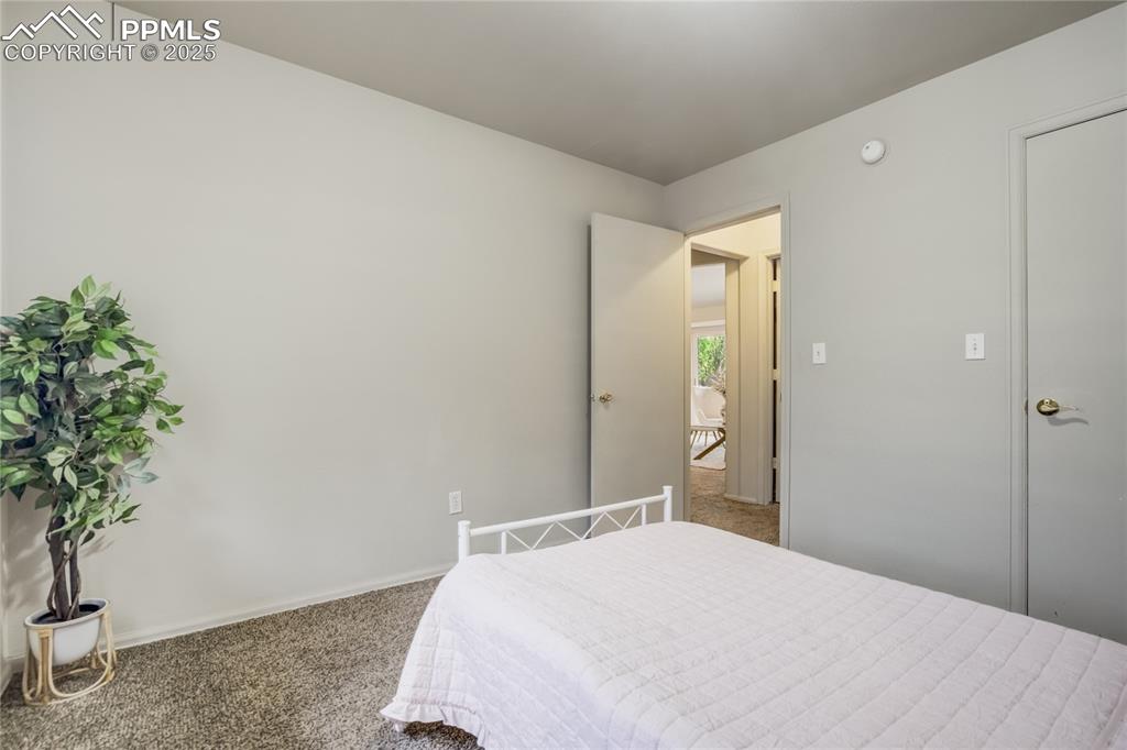 Image 22 of 42: Carpeted bedroom with baseboards
