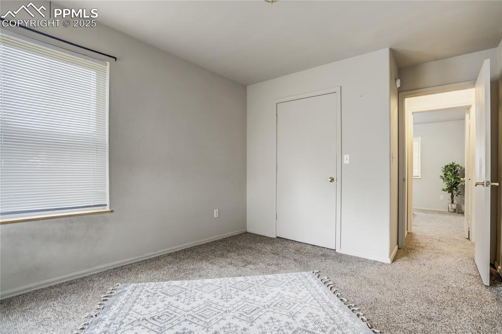Image 24 of 42: Unfurnished bedroom featuring carpet floors and baseboards