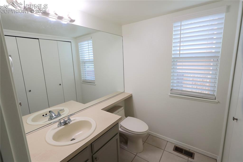 Image 24 of 39: Guest Bathroom w/ Laundry Area