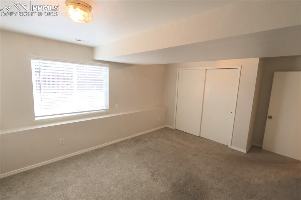 Image 28 of 39: Unfurnished bedroom featuring carpet flooring and a closet