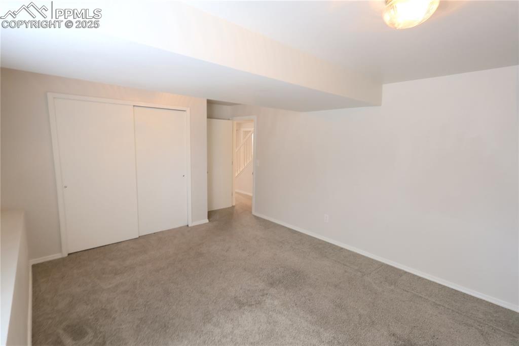 Image 29 of 39: Unfurnished bedroom with carpet floors and a closet