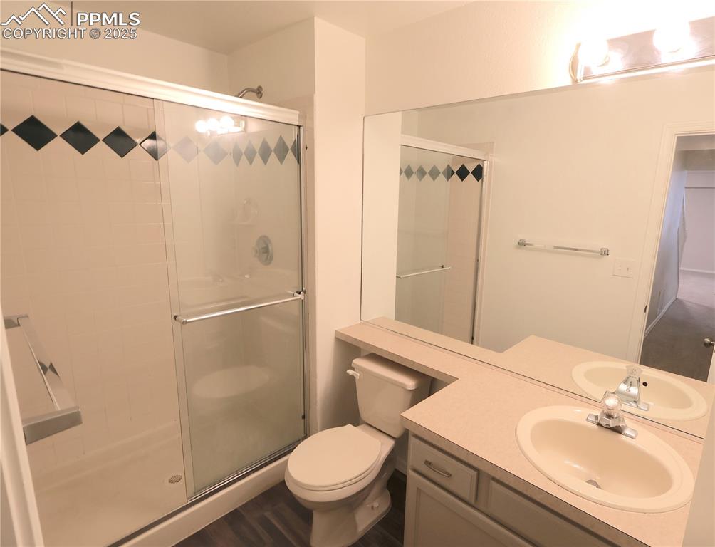 Image 31 of 39: Full bath featuring a shower stall and vanity