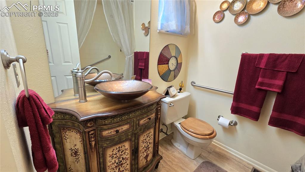Image 16 of 42: Full bath featuring vanity and a textured wall