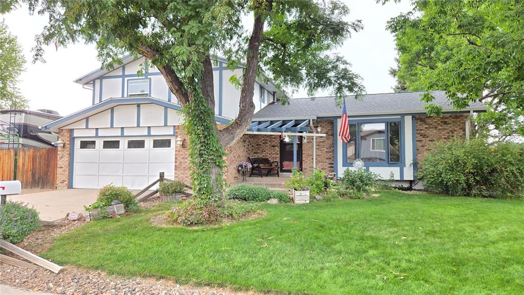 Image 44 of 44: View of front of home featuring brick siding, driveway, an attached garage,