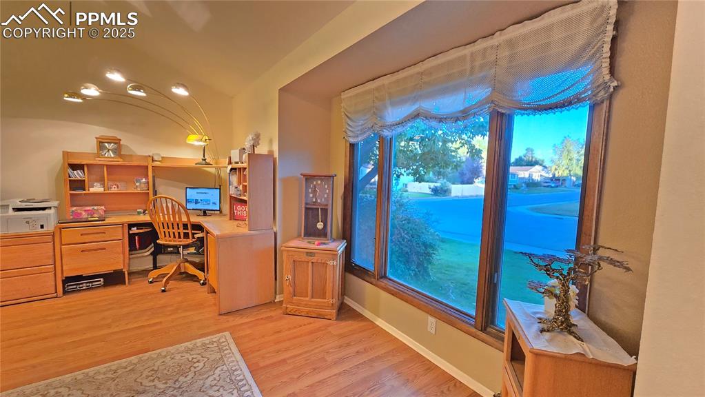 Image 5 of 42: Home office with light wood-style floors and baseboards