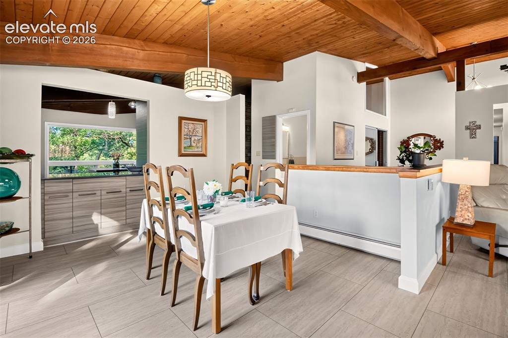 Image 10 of 49: The dining room can easily accommodate a long table. Note the buil-in cabin