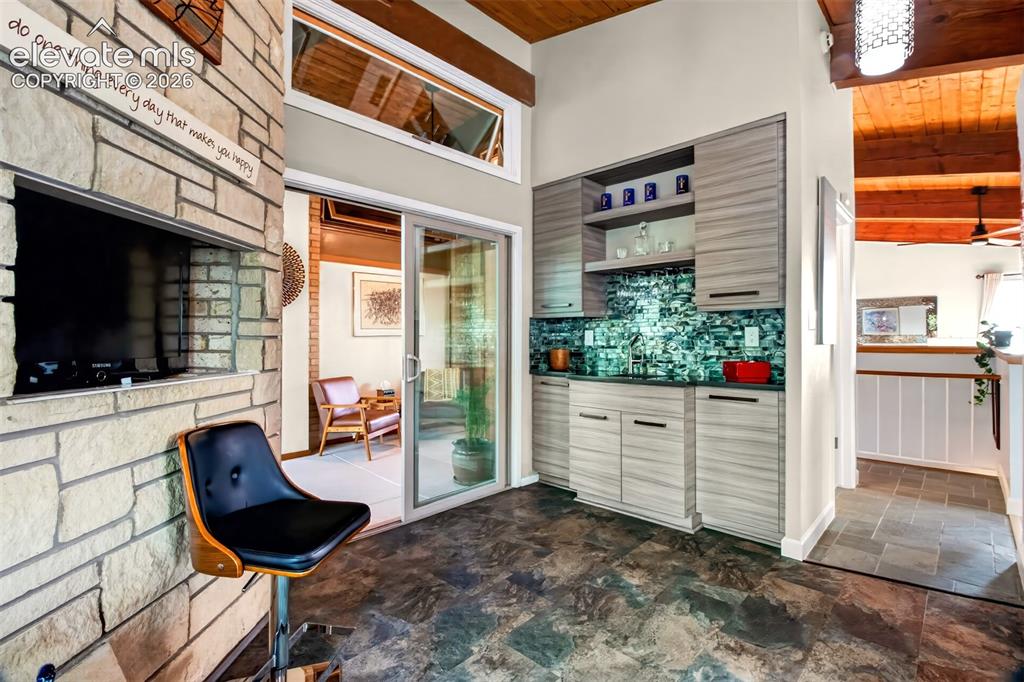 Image 17 of 49: In one corner of the kitchen there is a wet bar perfect for entertaining