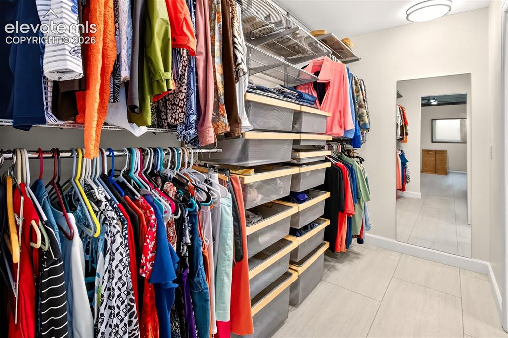 Image 25 of 49: The primary bedroom has buil-ins in the walk-in closet