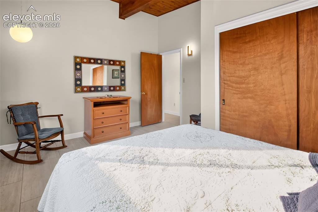 Image 31 of 49: 3rd bedroom on main level is a perfect guest room