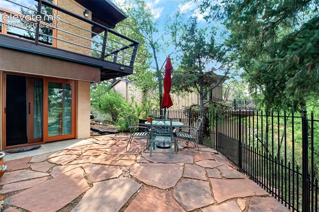 Image 36 of 49: a view of the flagstone patio off of the mother-in-law suite