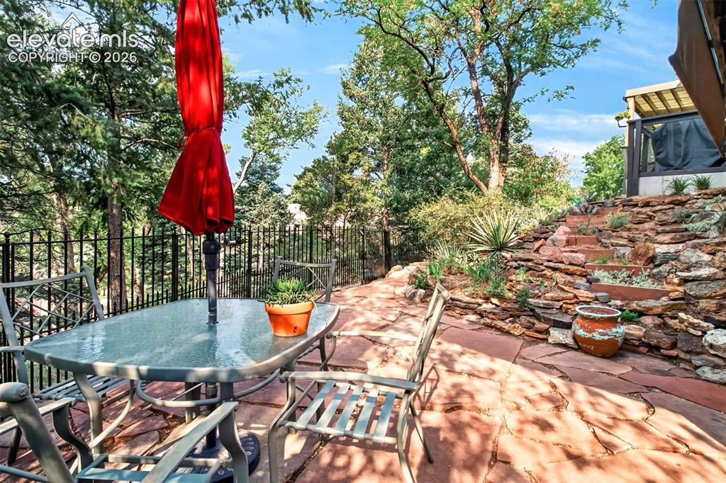 Image 37 of 49: A private flagstone patio off of the walk-out basement
