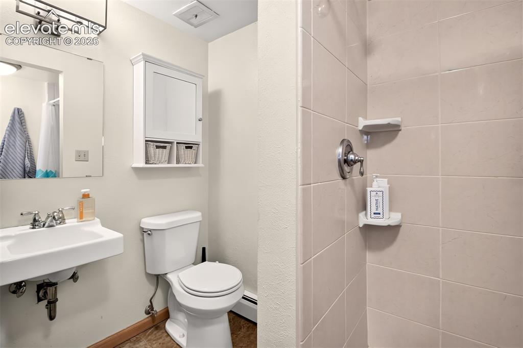 Image 39 of 49: The 3/4 basement bathroom
