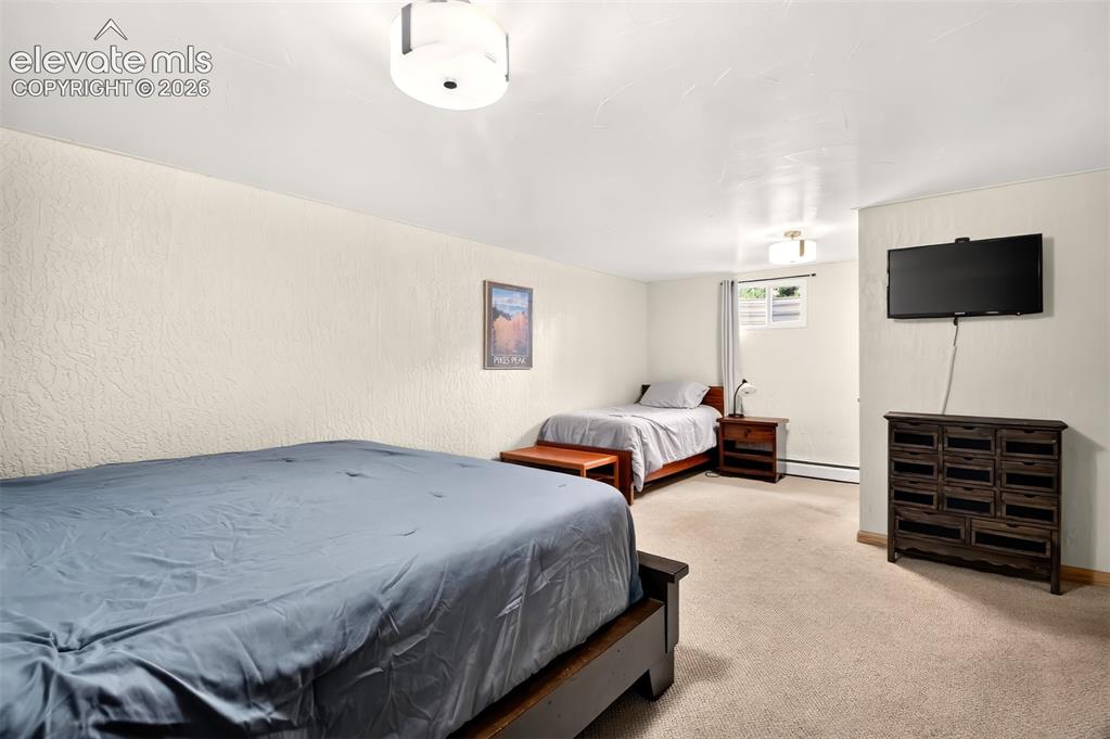 Image 41 of 49: The basement bedroom is perfect for a mother-in-law suite.