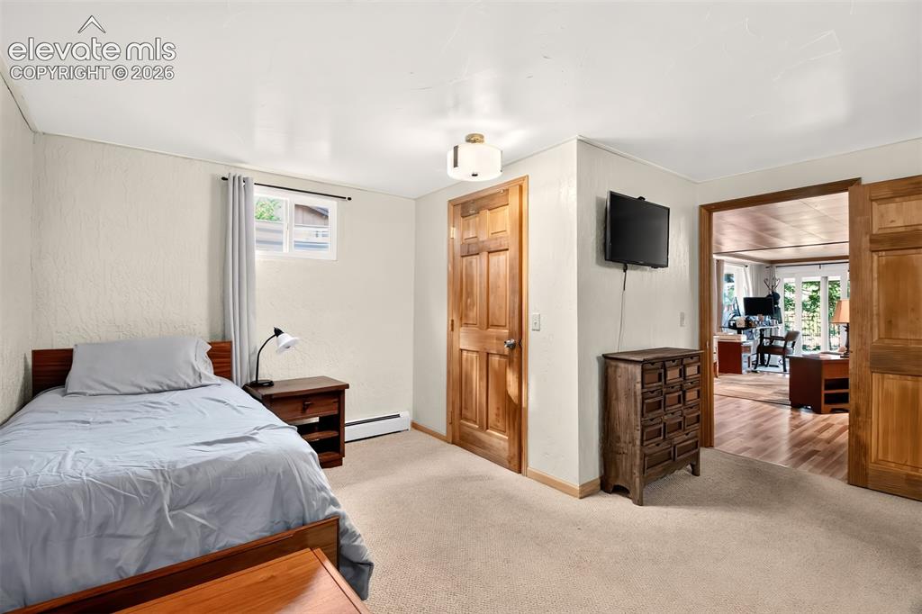 Image 42 of 49: The basement bedroom is large enough to accommodate 2 beds and a large walk