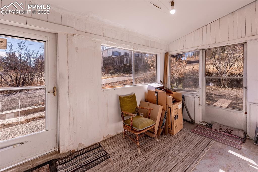 Image 13 of 23: Sunroom / solarium featuring lofted ceiling