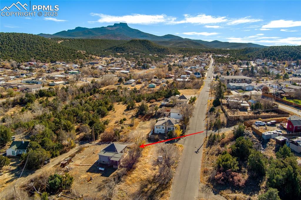 Image 20 of 23: Aerial perspective of suburban area with a mountainous background