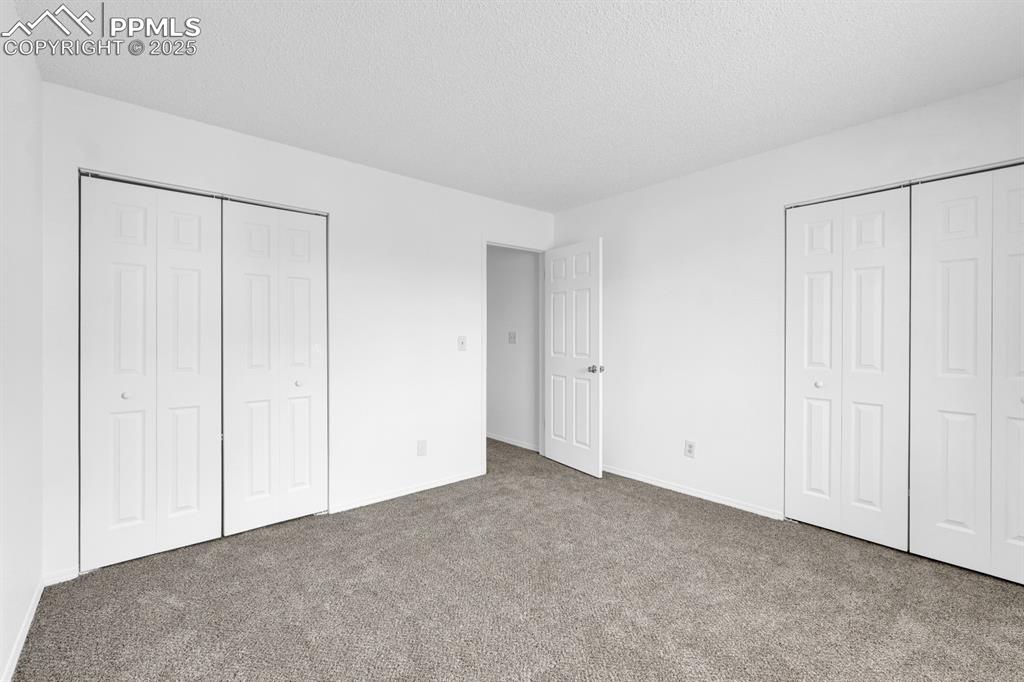 Image 12 of 15: Bedroom 1 with not one but TWO closets.