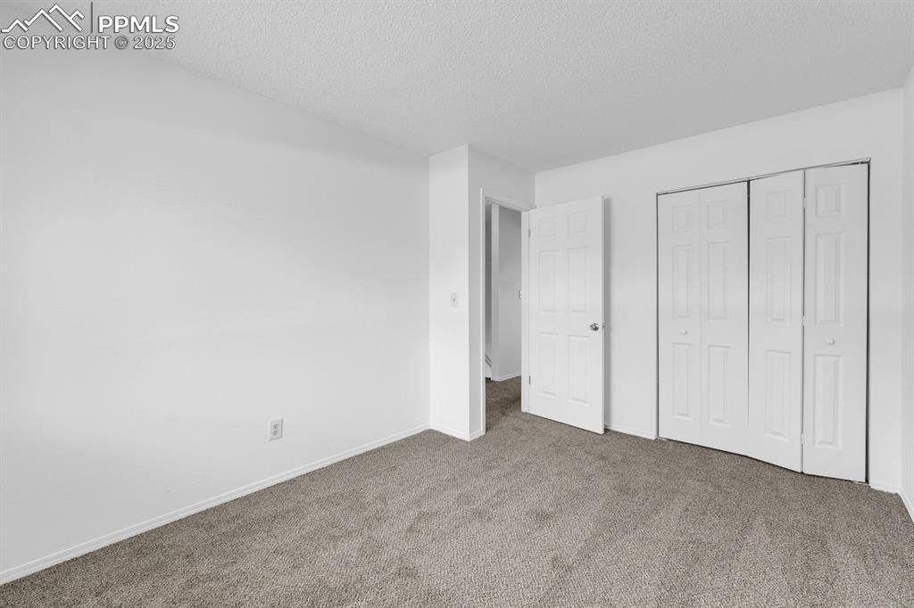 Image 14 of 15: Bedroom 1 with not one but TWO closets.