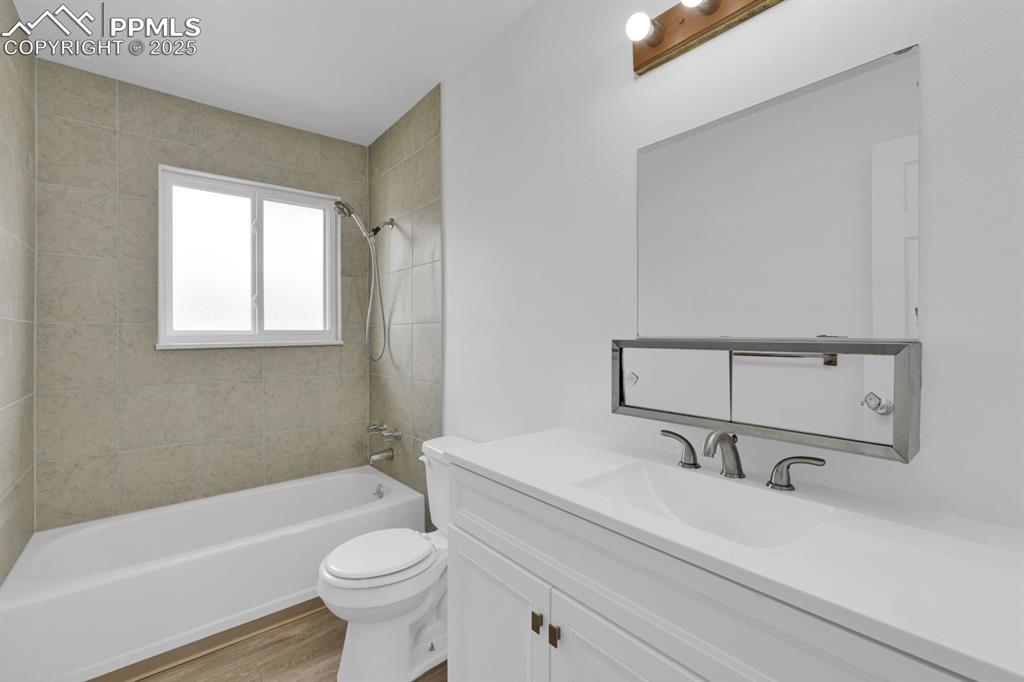 Image 15 of 15: Bathroom with updated vanity