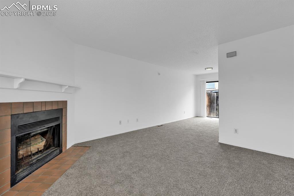 Image 4 of 15: Living Room Features Wood Burning Fire Place