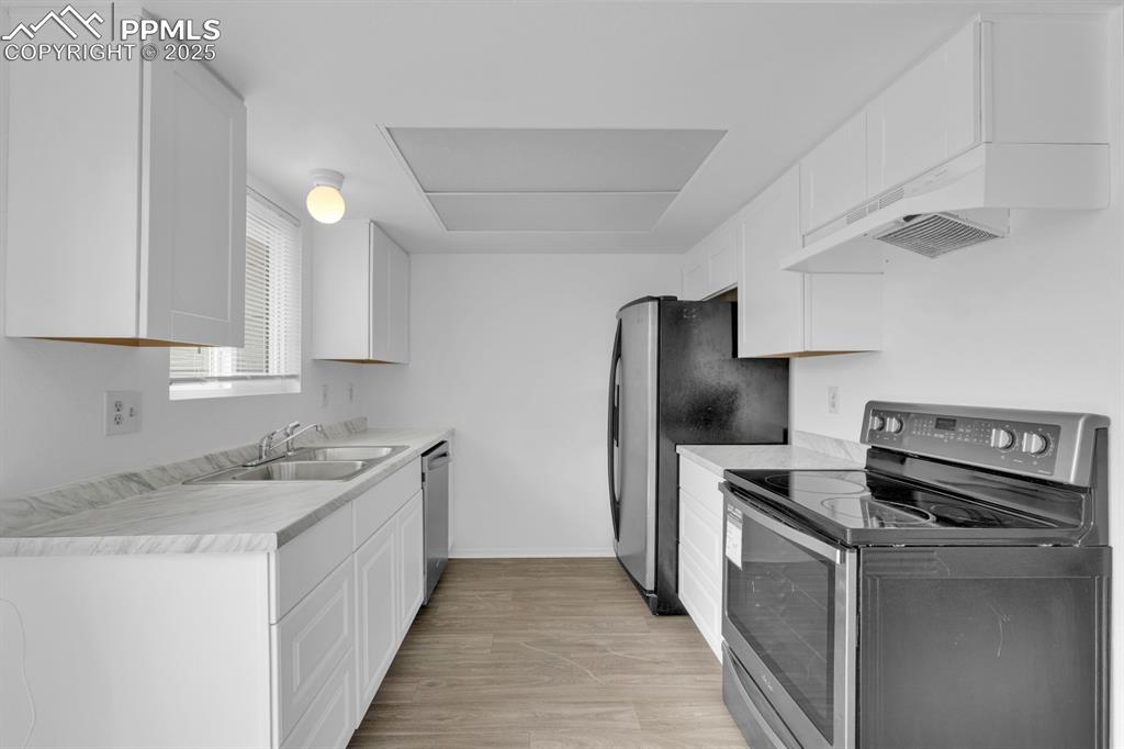 Image 7 of 15: Updated Kitchen with Stainless Steel Appliances