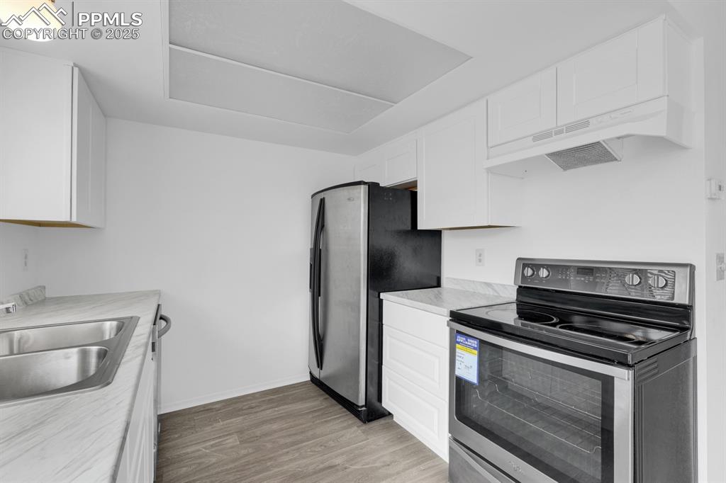 Image 9 of 15: Updated Kitchen with Stainless Steel Appliances