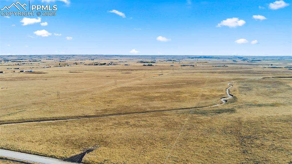 Image 3 of 10: Aerial view of sparsely populated area with a desert landscape
