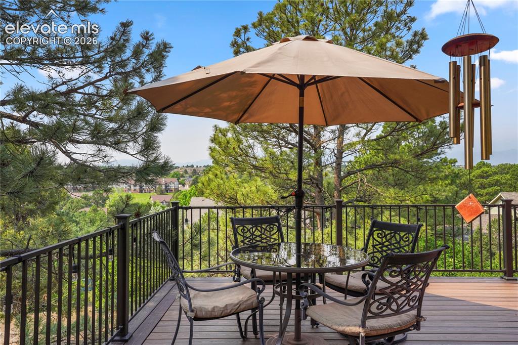 Image 10 of 39: This 21x19 L-shaped composite deck with wrought iron railing,...