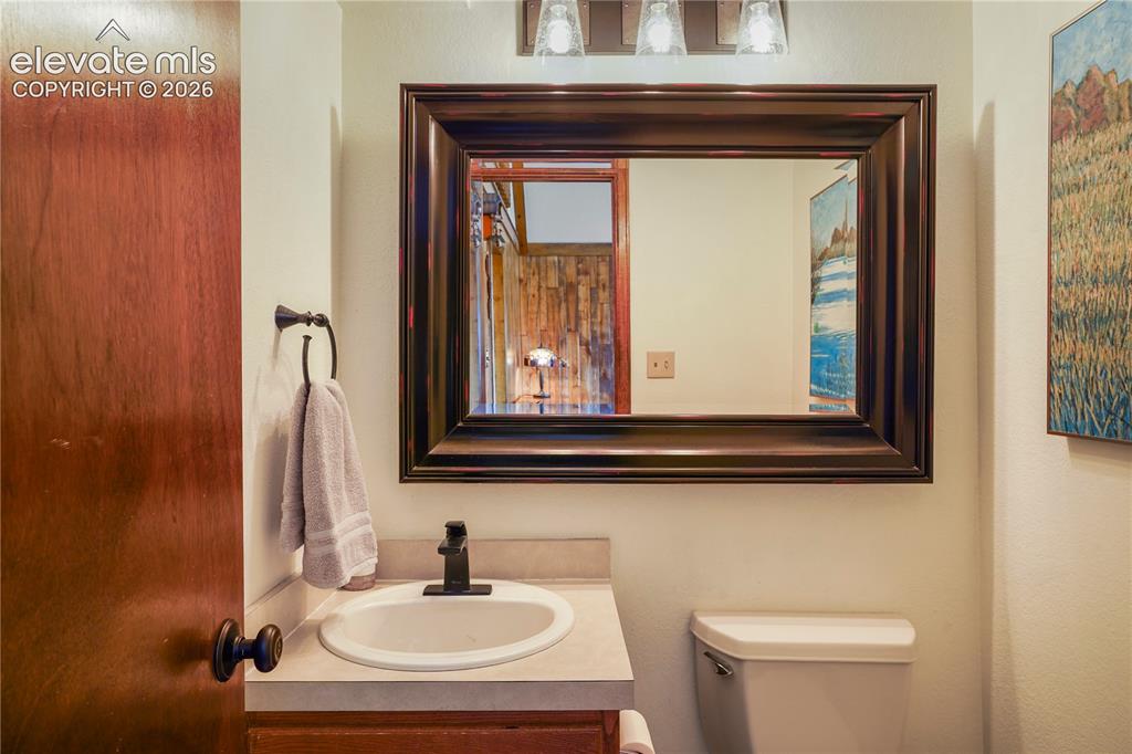 Image 17 of 39: Main floor powder room.