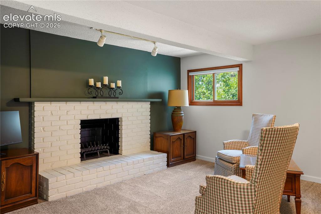 Image 30 of 39: non-working decorative brick fireplace.