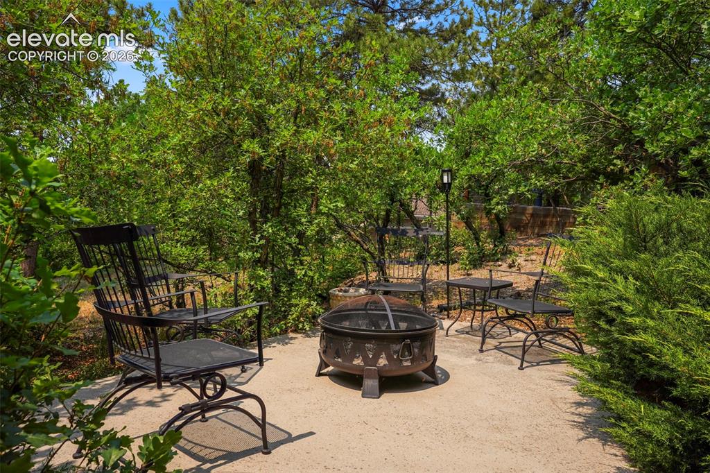 Image 33 of 39: and private concrete firepit area.