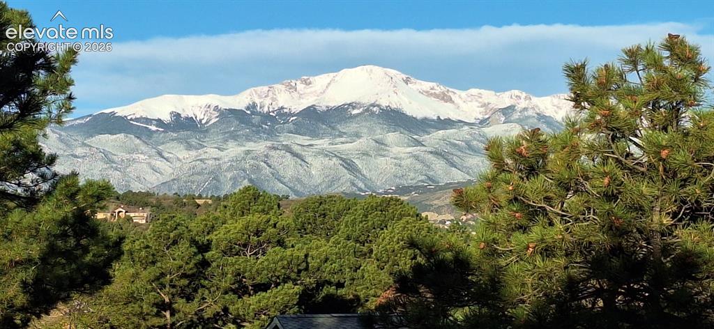 Image 39 of 39: Snowy view of Pikes Peak from deck