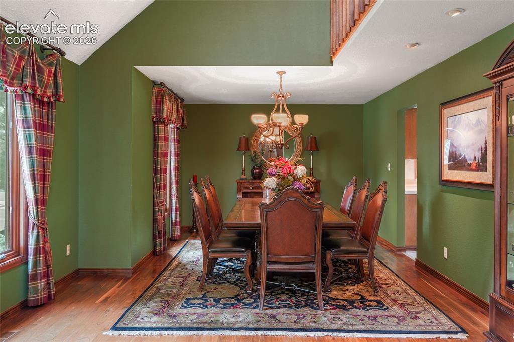 Image 5 of 39: The formal dining room greets you to the left of the entry, ideal for hosti