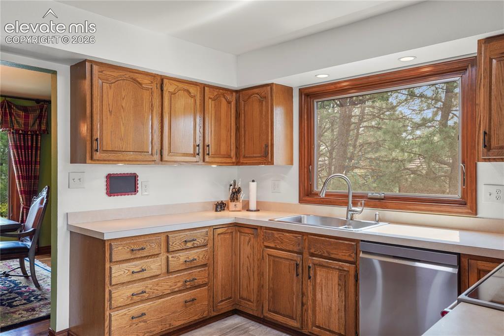 Image 6 of 39: The eat-in kitchen boasts all-new appliances, new sink, picture window...