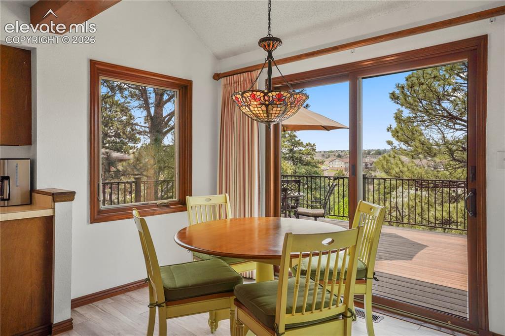 Image 9 of 39: and vaulted breakfast nook & Tiffany light fixture, which opens onto the ne