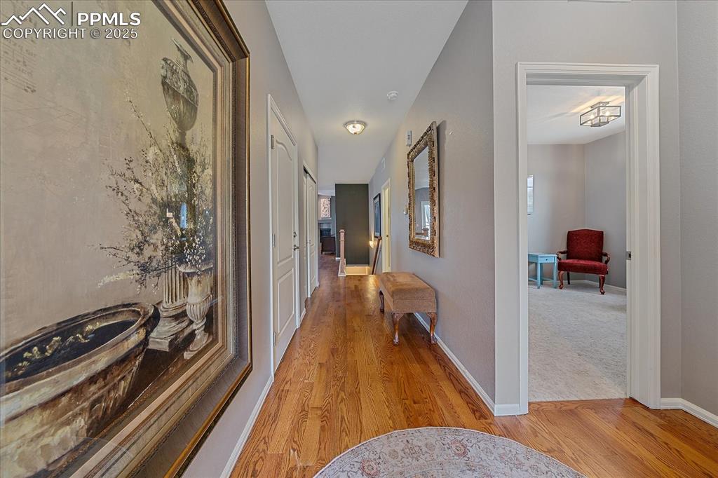Image 5 of 49: Hall featuring baseboards and light wood-style floors