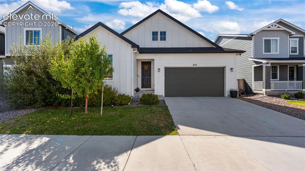 Image 1 of 46: White siding exterior with black trim accents
