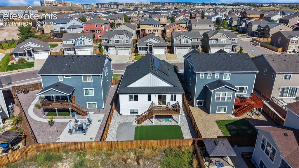Image 37 of 46: Expansive neighborhood setting featuring numerous residential properties