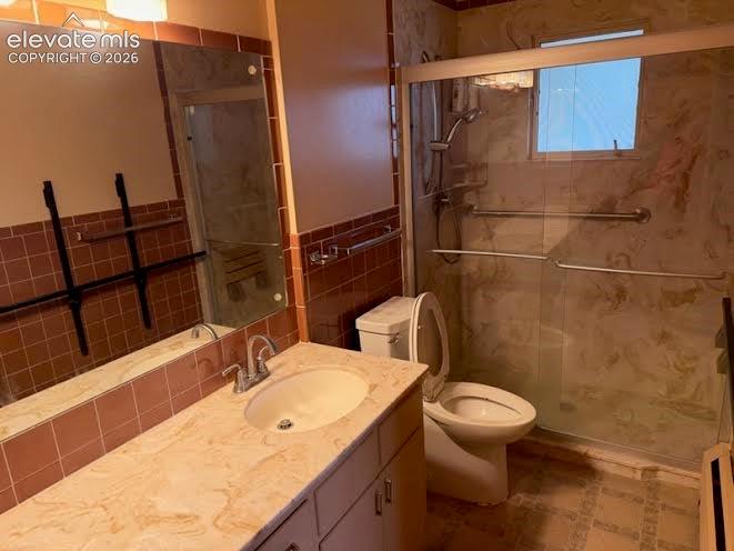 Image 10 of 27: Updated with a walk-in shower